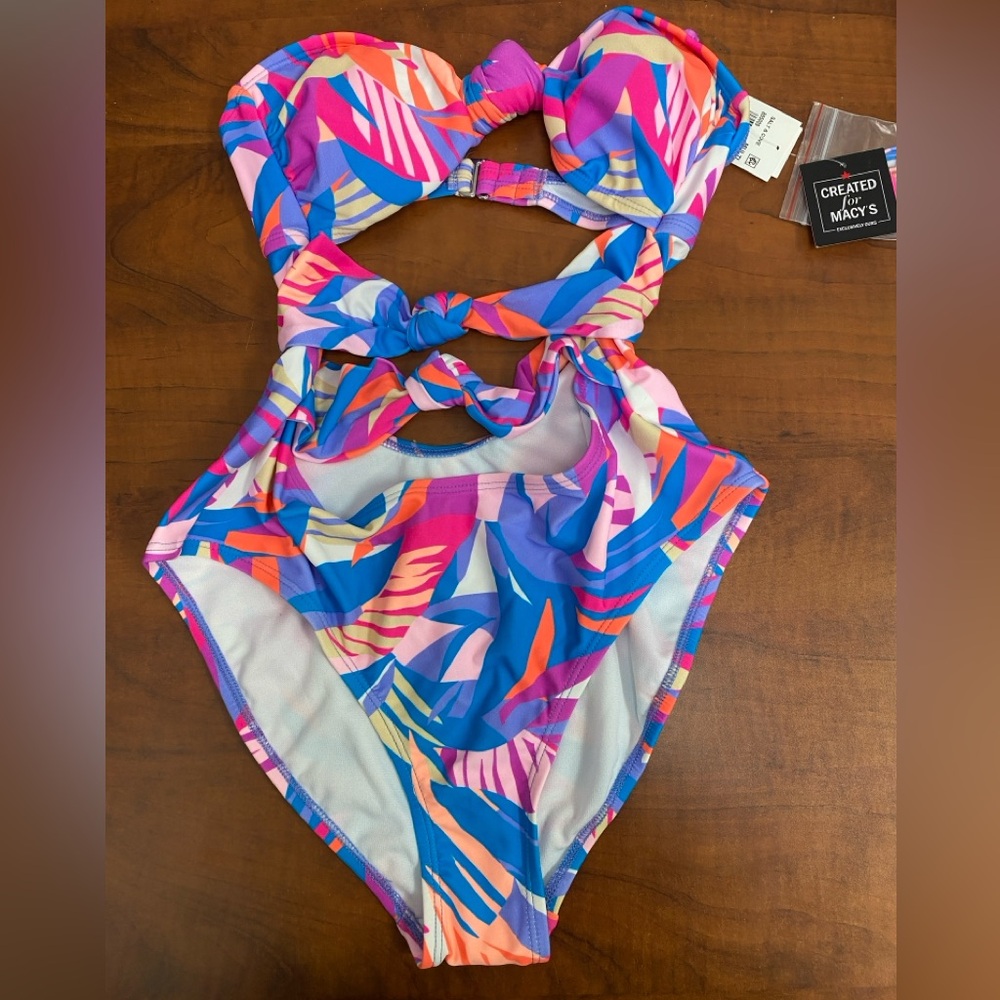 New Swimsuit with cutouts, size medium.